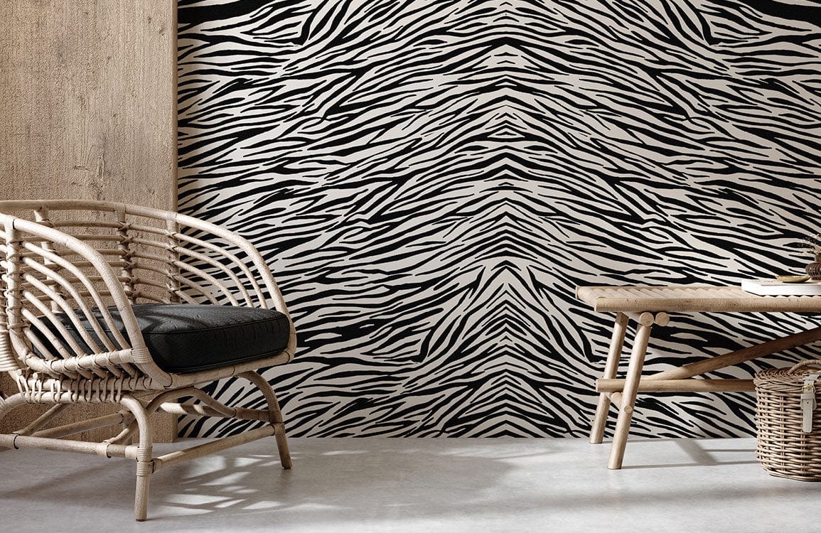 Monochrome zebra stripe wallpaper, rattan chair, concrete flooring, wooden table, modern living room design.