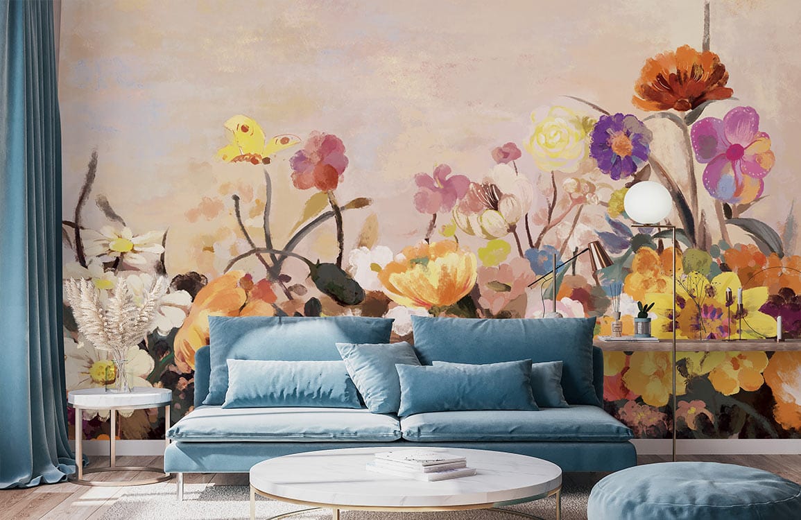 Vibrant Floral Garden Mural Wallpaper in living room with blue sofa, round table, and wood flooring.