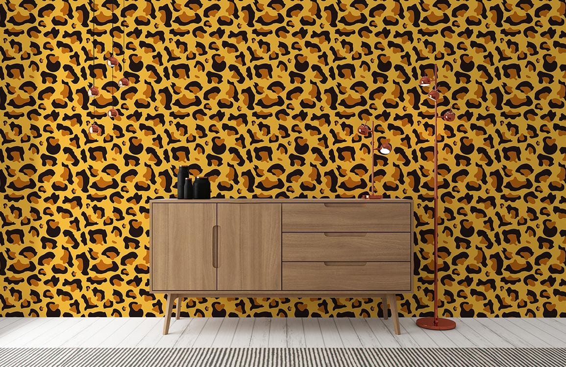 Leopard print wallpaper in black and golden tones with wooden sideboard and white flooring.