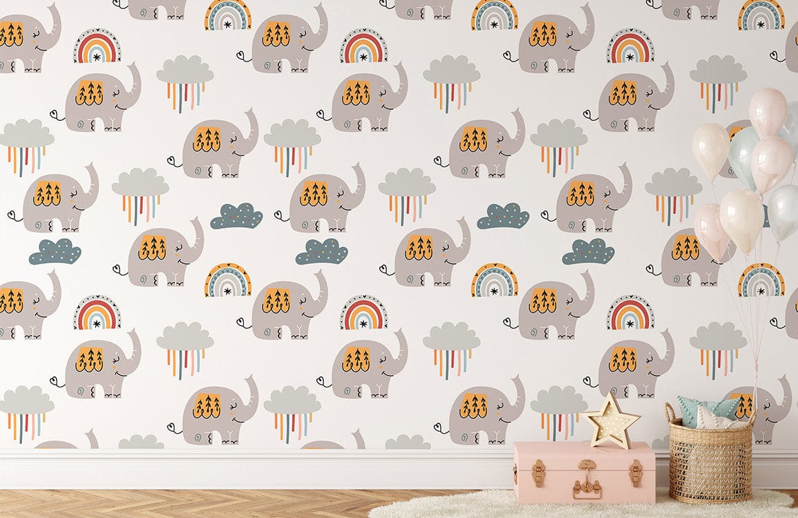 Playful elephant and rainbow nursery wallpaper with wicker basket and pink trunk in child's room.