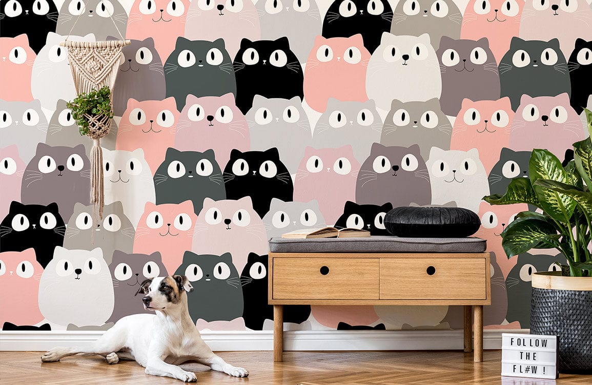 Whimsical pastel cat wallpaper in nursery featuring wooden bench, plant, and playful dog on flooring.