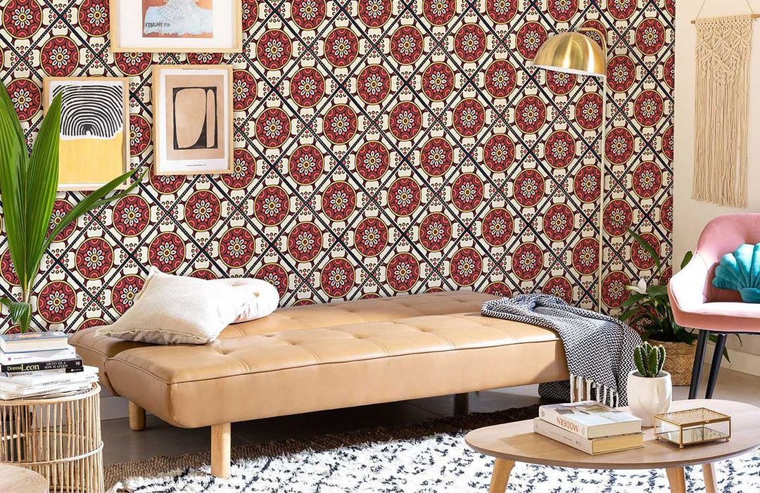 Living room with vintage Mediterranean floral tile wallpaper, beige leather sofa, and decorative wall art.