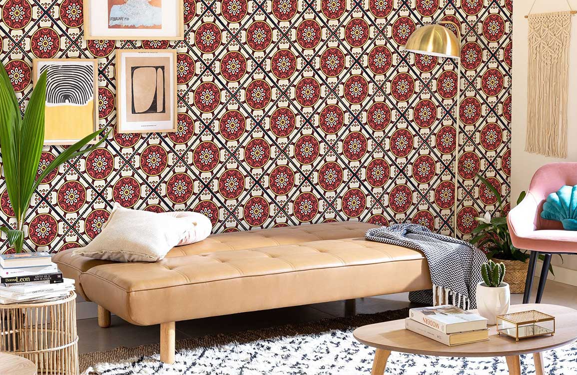 Living room with vintage Mediterranean floral tile wallpaper, beige leather sofa, and decorative wall art.