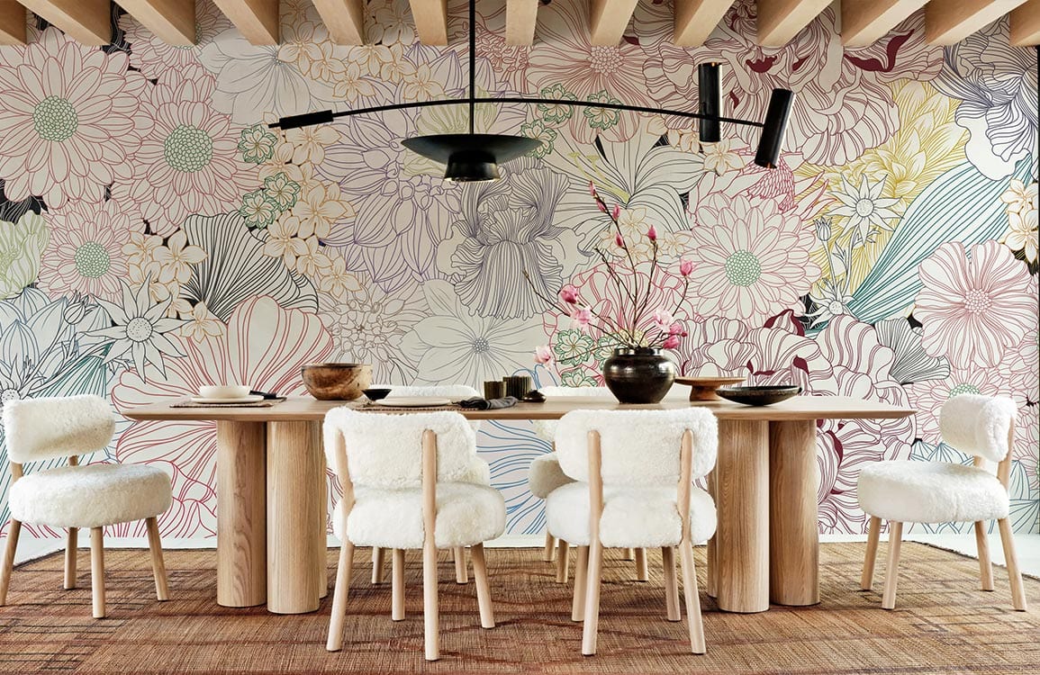 Dining room with Floral Elegance Bloom Pastel Mural Wallpaper, wooden table, white chairs, woven rug.