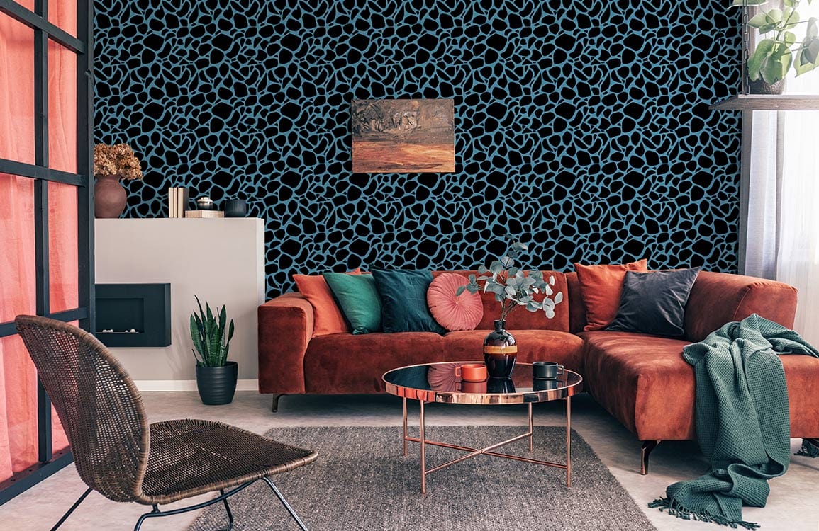 Aqua Pebble Pattern Wallpaper in modern living room, featuring rust sofa, grey rug, and chair.