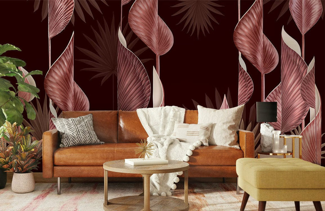 Floral wallpaper with dark red, pink leaf patterns behind brown leather sofa, white cushions, modern decor.