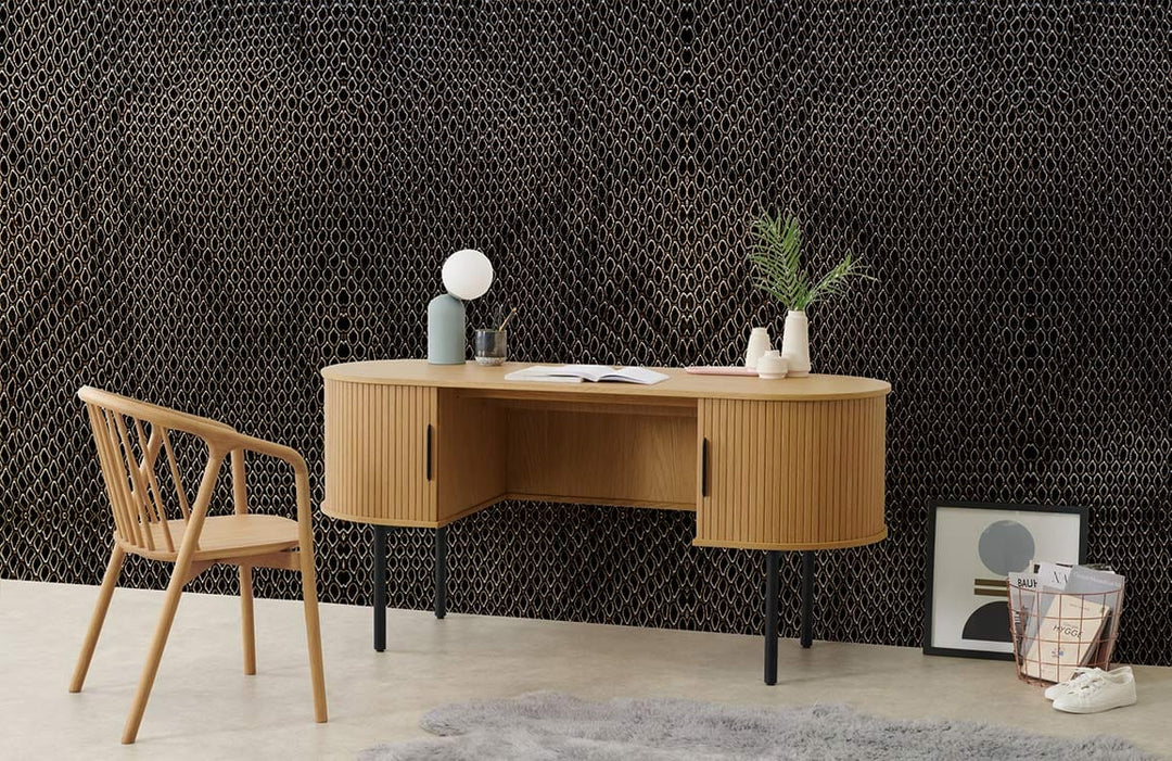 Luxurious textured brown geometric pattern wallpaper in modern office with wooden desk and chair.