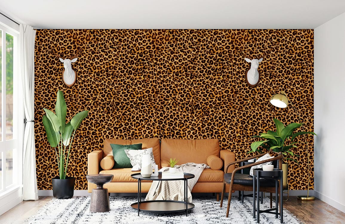 Exotic leopard print wallcovering, earthy tones, orange sofa, wooden flooring, modern living room decor.