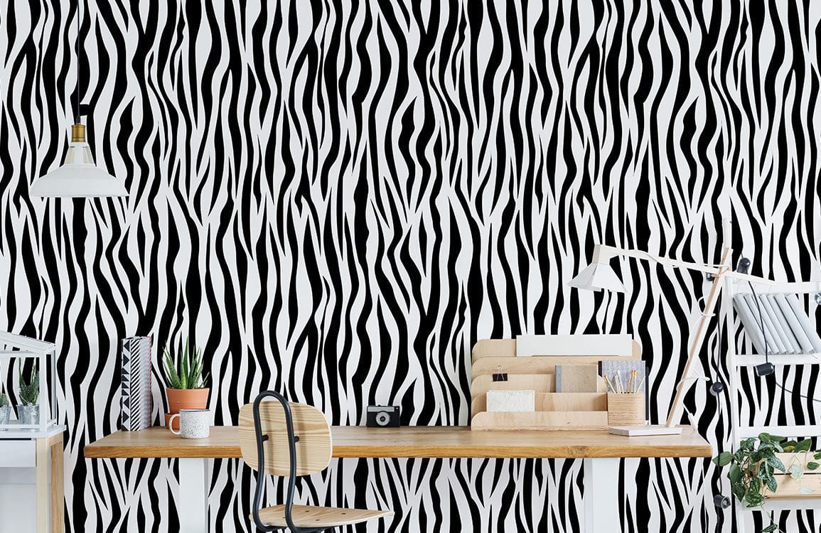 Monochrome zebra stripe wallpaper in office setting with wooden desk, modern chair, and stylish decor.