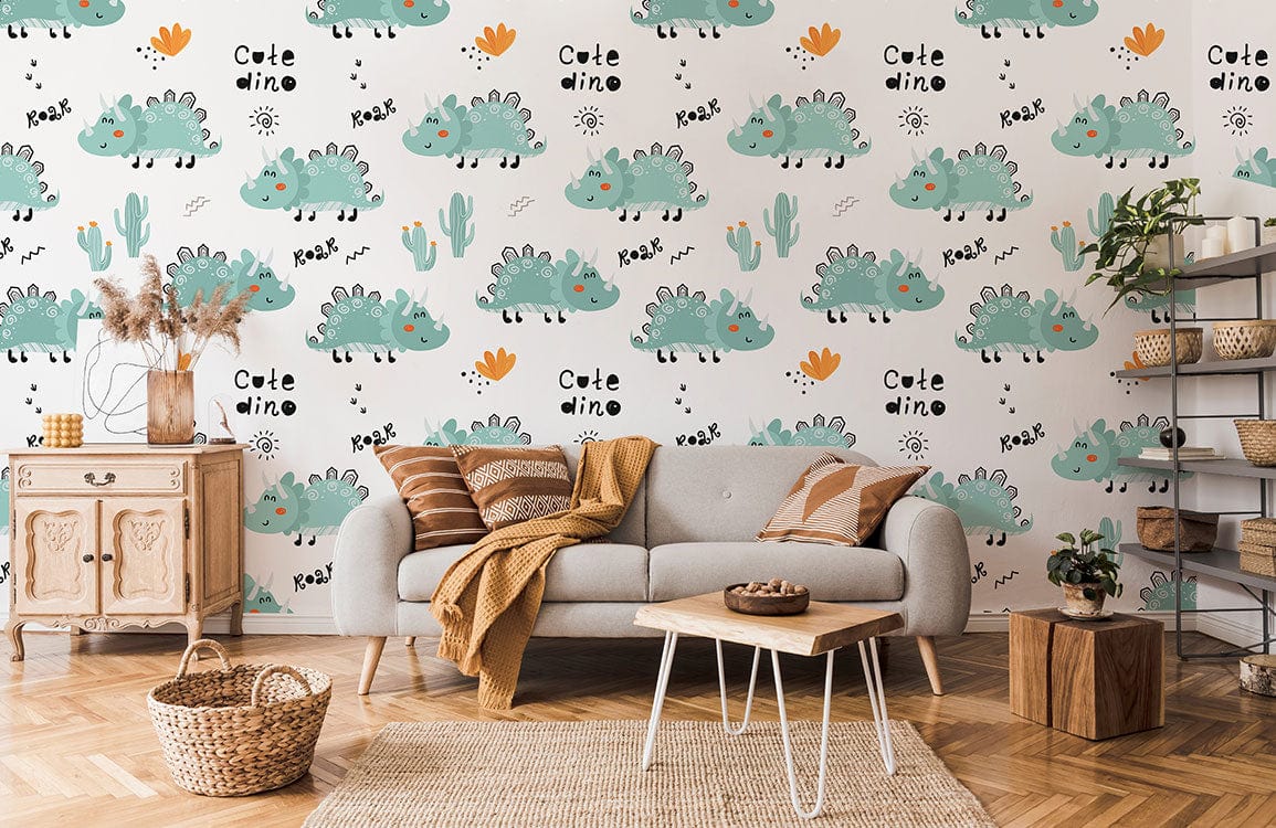 Adorable green dinosaur wallpaper in cosy living room with grey sofa, wooden furniture, and herringbone flooring.