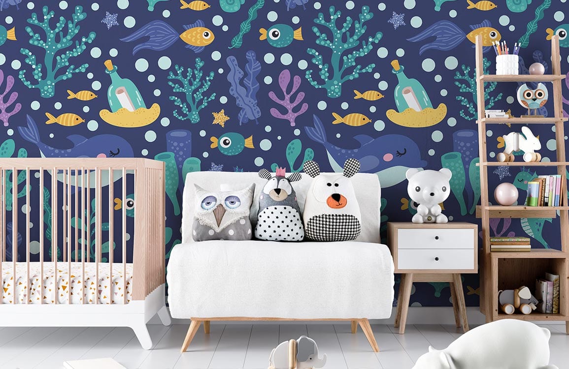 Underwater Adventure navy nautical kids mural wallpaper with sea creatures, white sofa, light wood flooring.