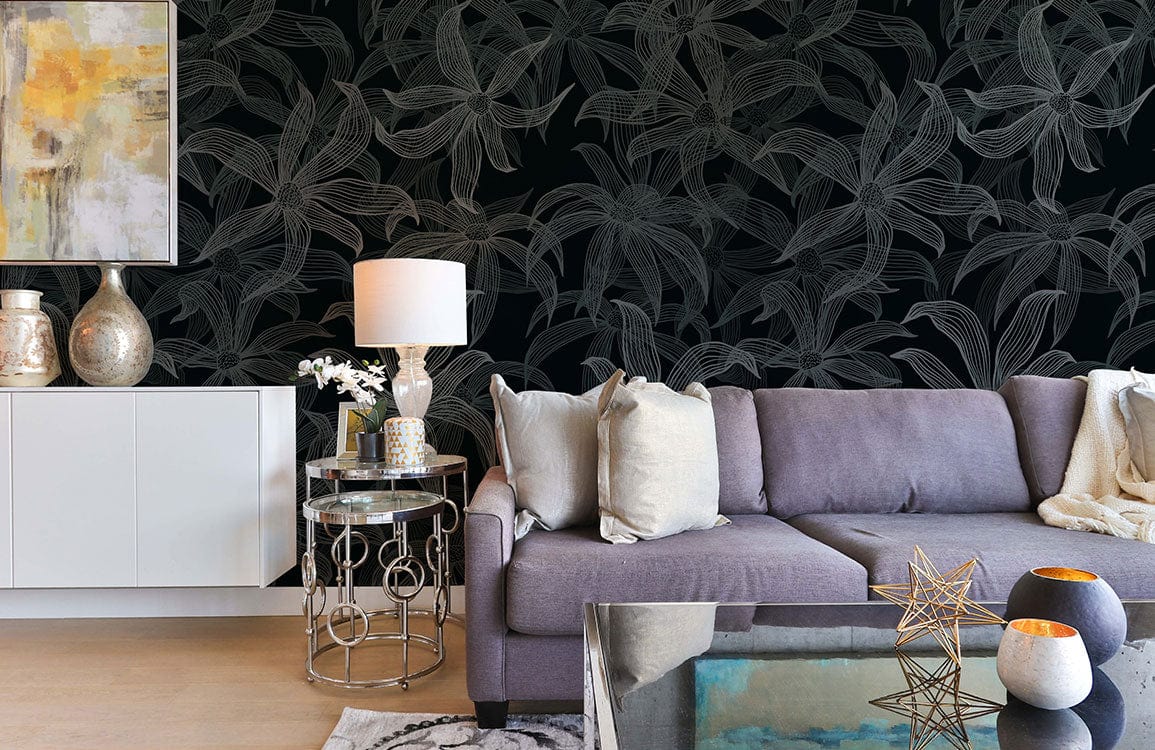 Elegant dark floral wallpaper with charcoal leaf design, grey sofa, abstract painting, contemporary decor.