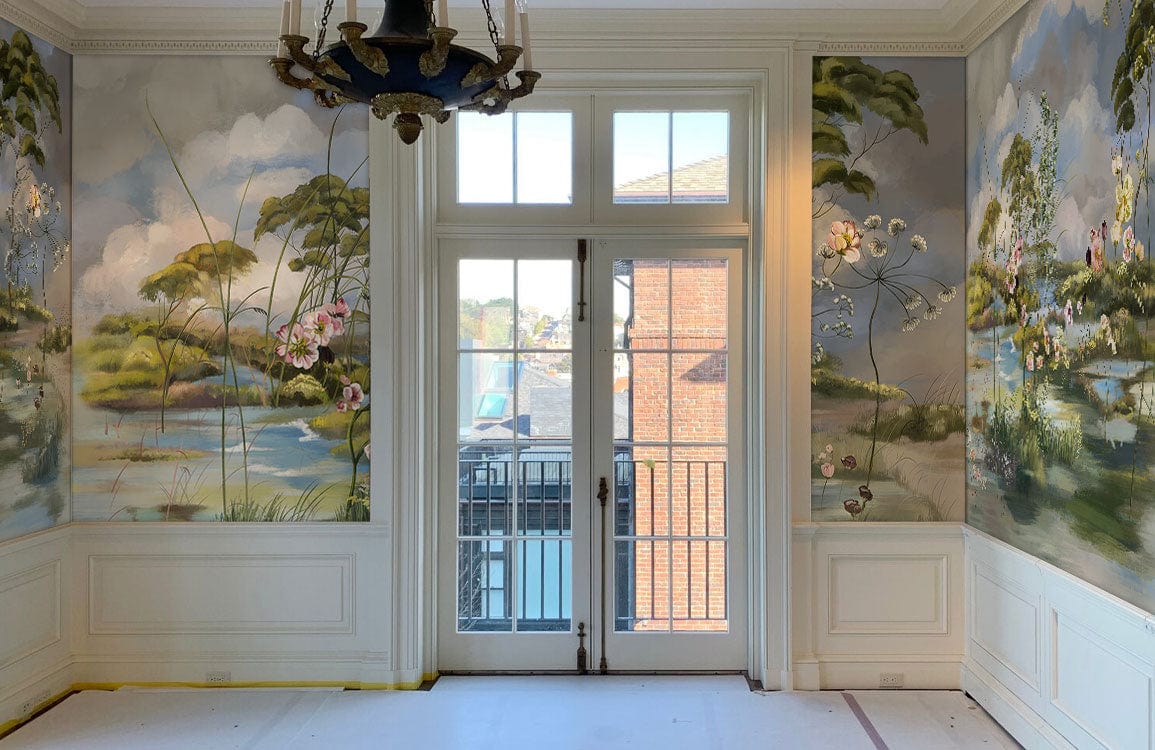 Pastoral Haven mural wallpaper with floral tones in elegant room, featuring French doors and chandelier.