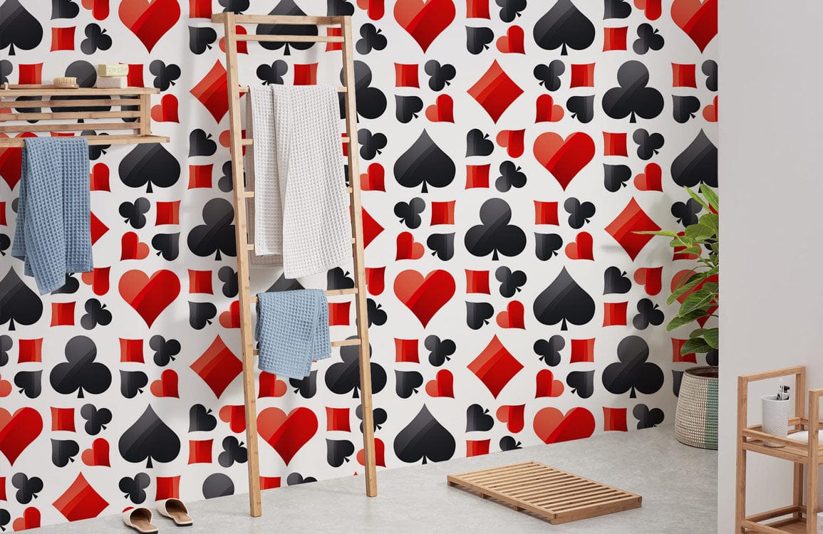 Poker-themed red and black card suit wallpaper in modern bathroom with wooden towel rack, grey flooring.
