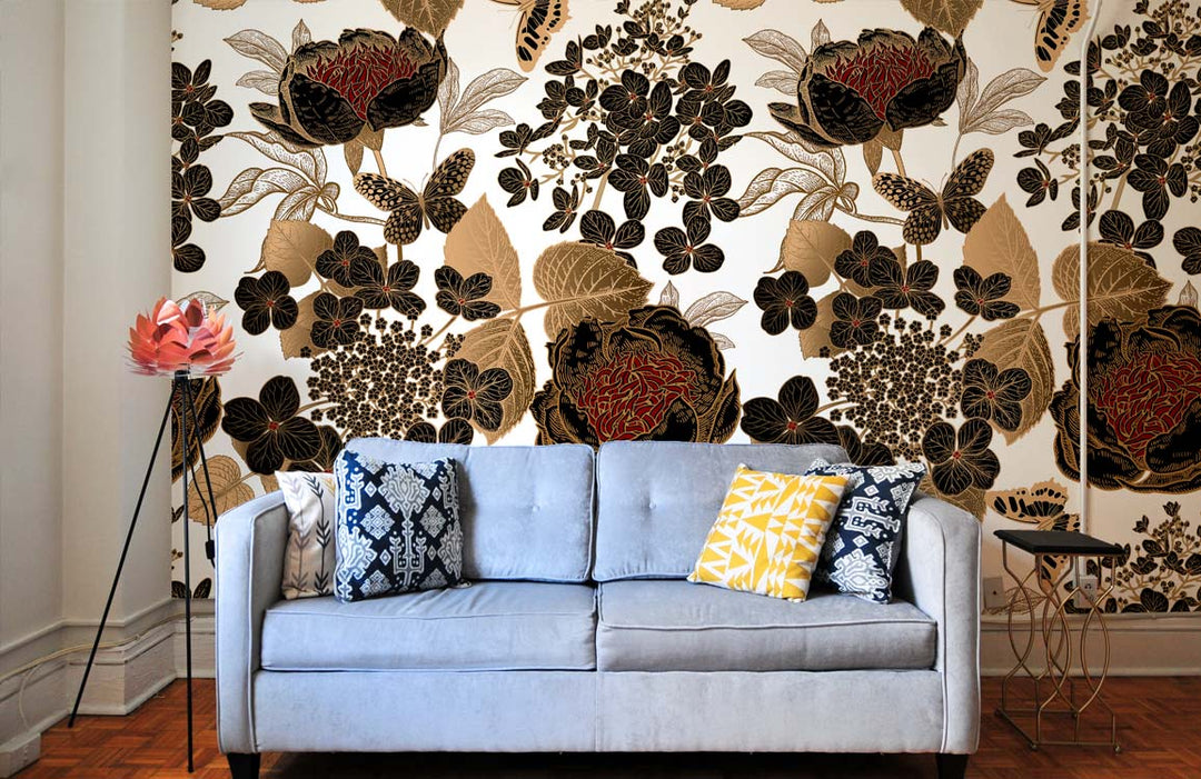 Vintage Floral Elegance wallpaper in black and gold with modern grey sofa in stylish living room.