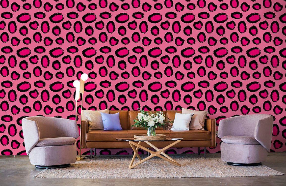 Tropical Pink Leopard Print Wallpaper with chic design, brown sofa, modern chairs, wooden coffee table.