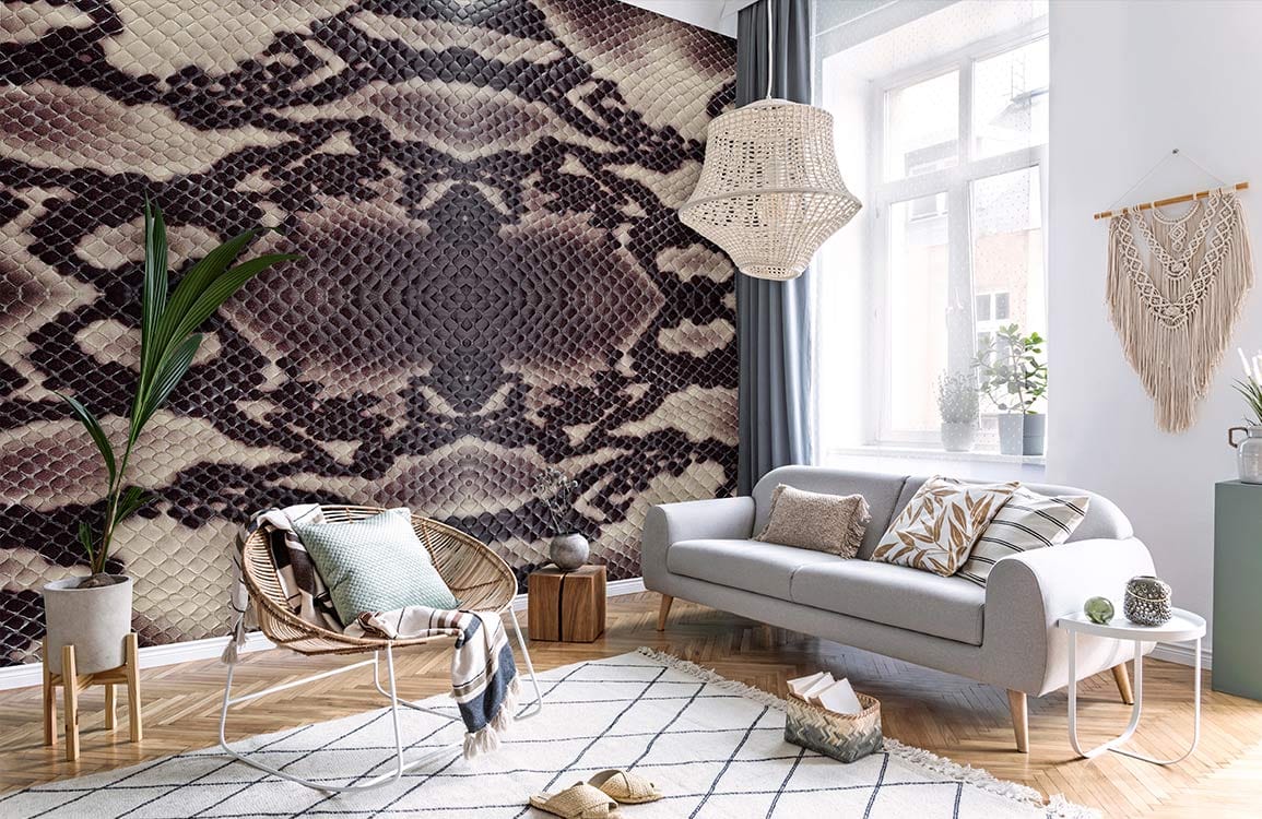 Luxurious living room featuring exotic snake skin wallpaper, grey sofa, geometric rug, and wooden flooring.