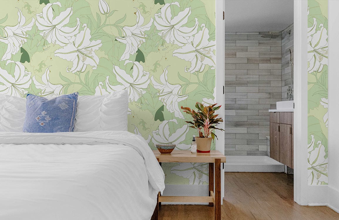 Elegant lily pattern wallpaper, soft green; bedroom setting with white bed, wooden floor, modern bathroom.