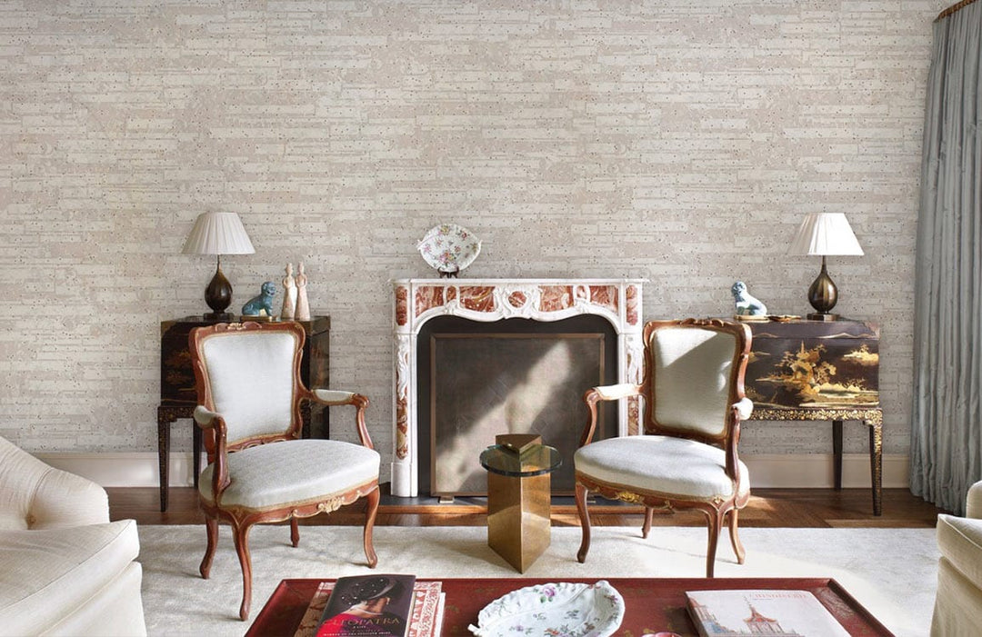 Neutral brick wallpaper in elegant living room, ornate fireplace, classic chairs, hardwood flooring, modern decor.