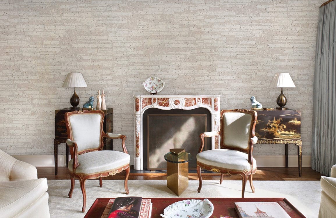 Neutral brick wallpaper in elegant living room, ornate fireplace, classic chairs, hardwood flooring, modern decor.