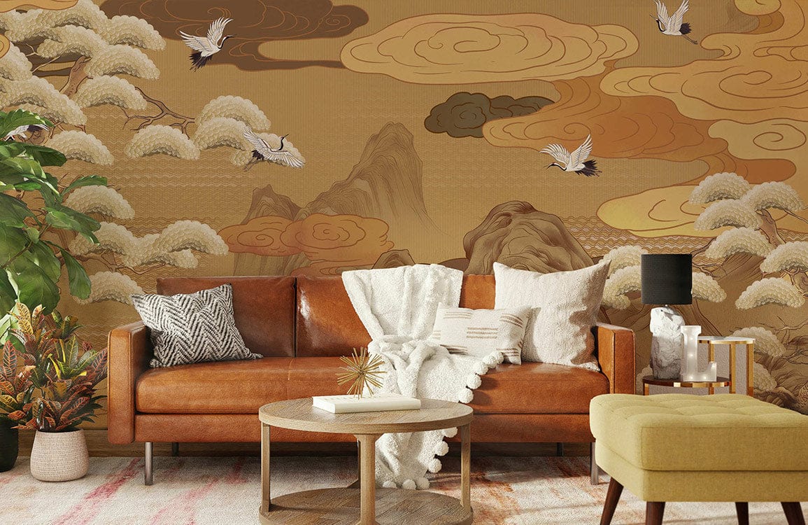 Elegant Oriental Crane mural wallpaper; vintage gold design; brown leather sofa; green plant; living room.