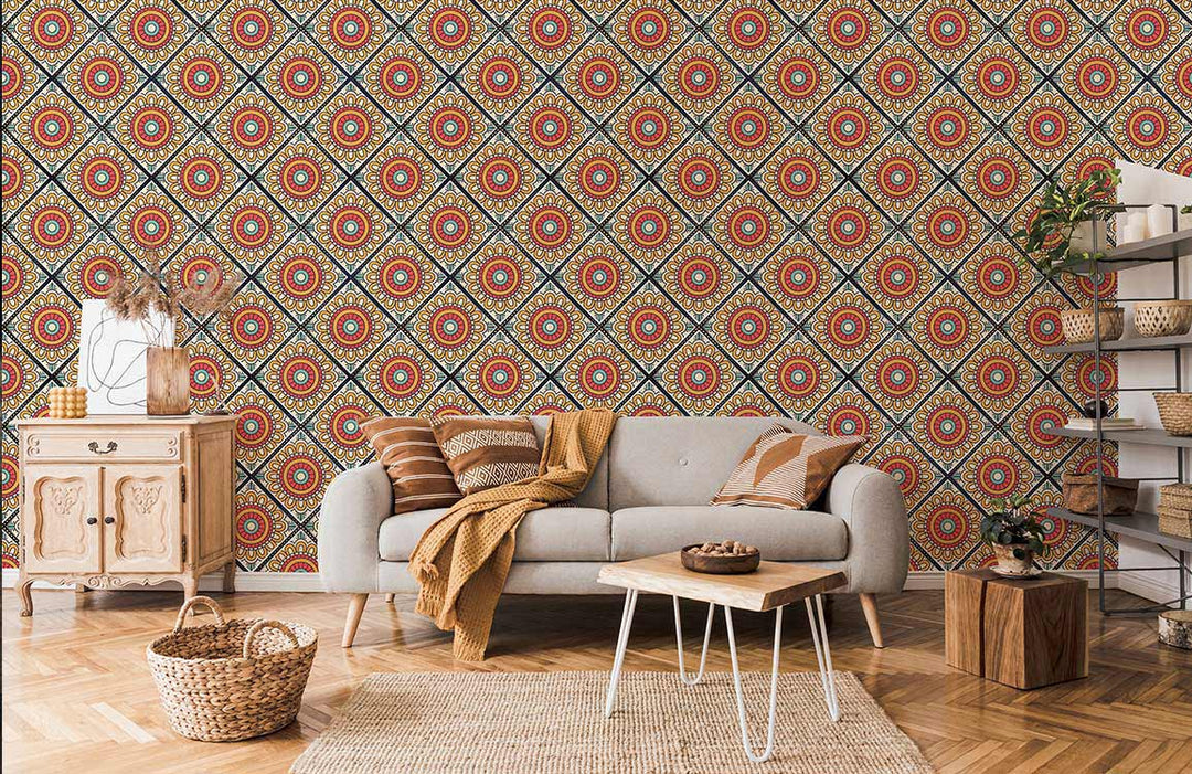 Retro geometric floral wallpaper in vibrant red and yellow; grey sofa, wooden furniture, living room.