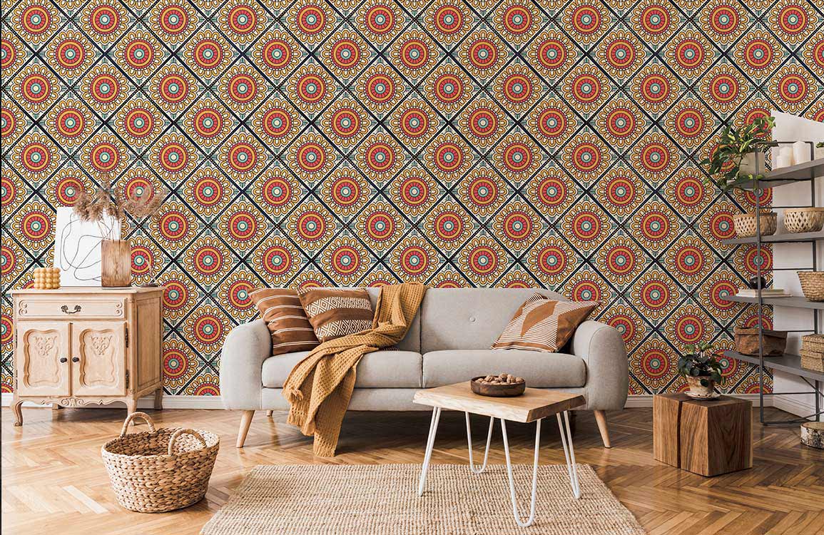 Retro geometric floral wallpaper in vibrant red and yellow; grey sofa, wooden furniture, living room.