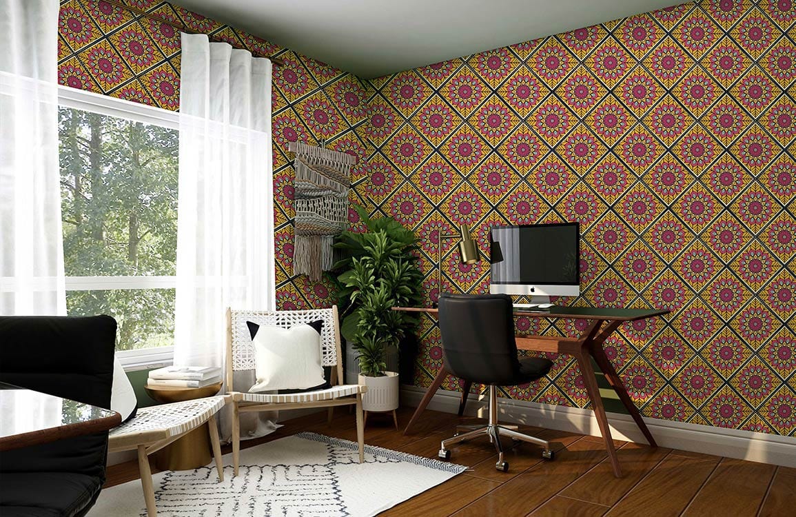 Vibrant geometric floral wallpaper in home office with wooden desk, modern chair, and natural light.