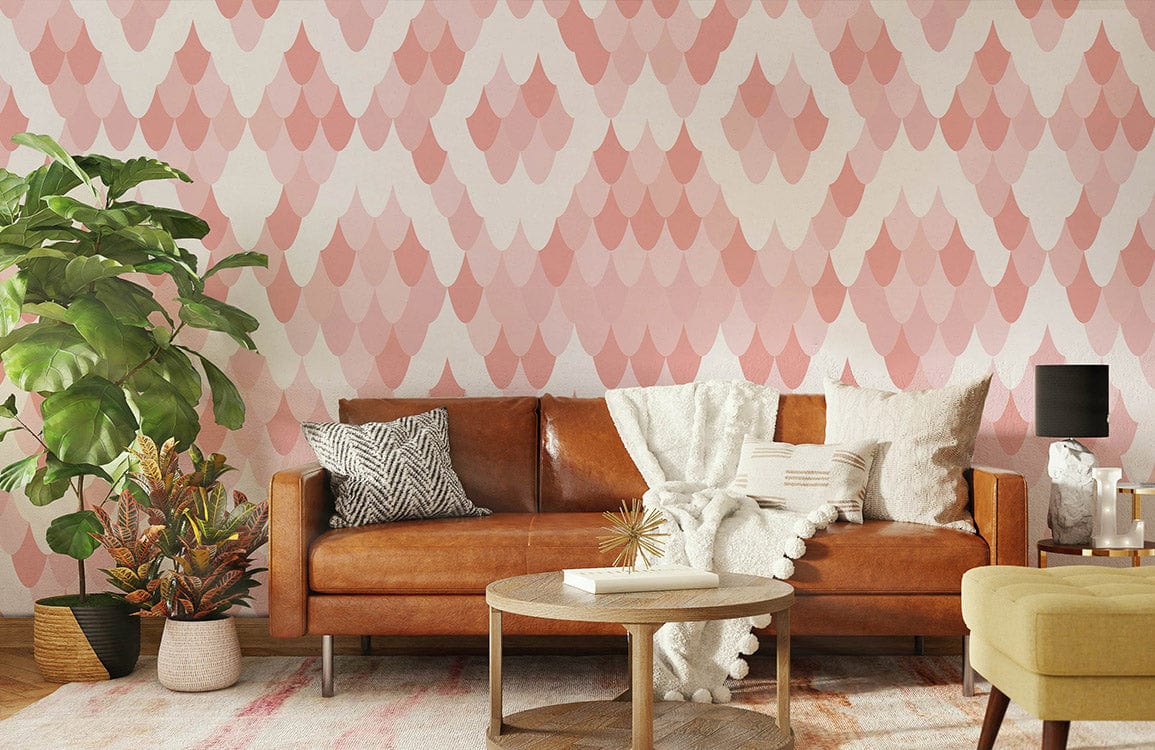 Geometric blush pink diamond wallpaper featuring brown leather sofa, wooden flooring, modern living room design.