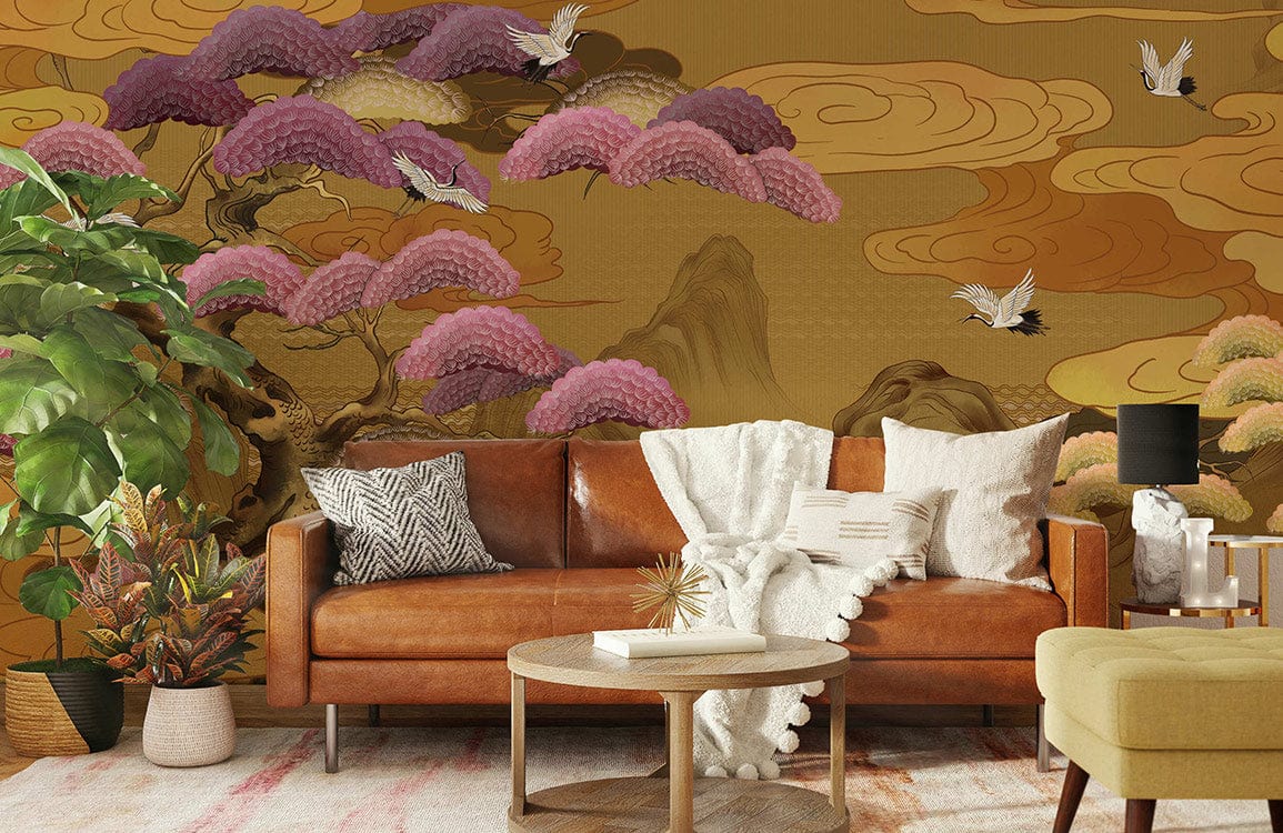 Elegant golden landscape mural with birds; pink trees; brown sofa; modern living room setting.