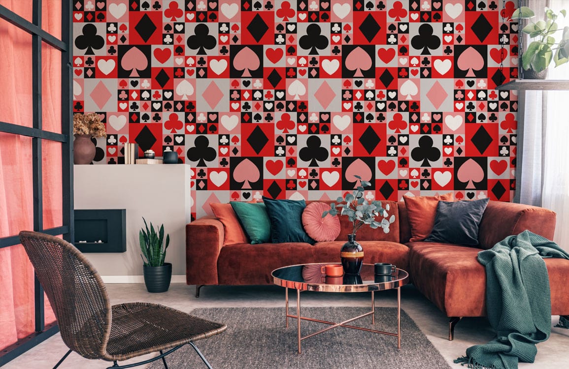 Retro playing card wallpaper, red sofa, modern living room decor, stylish carpet, and contemporary chair.