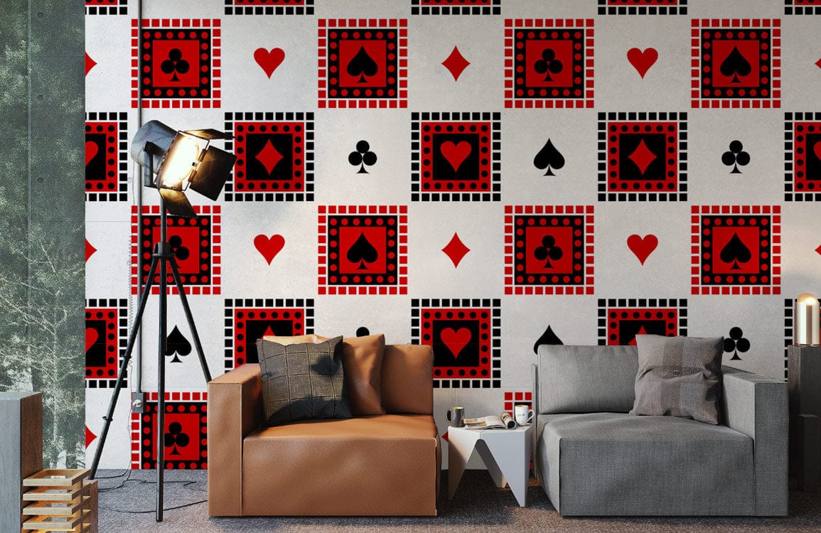 Red Black Geometric Playing Card Suits Wallpaper in modern living room with brown and grey sofas.