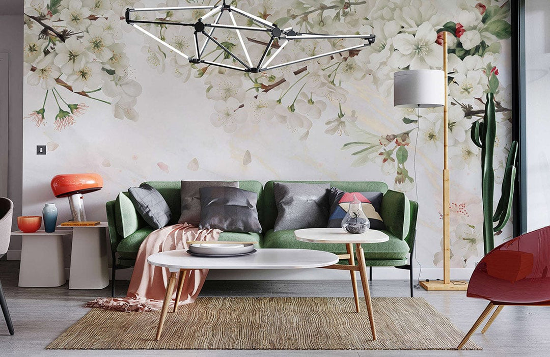 Elegant Blossom mural wallpaper in living room with green sofa, modern lighting, wooden floor, stylish decor.