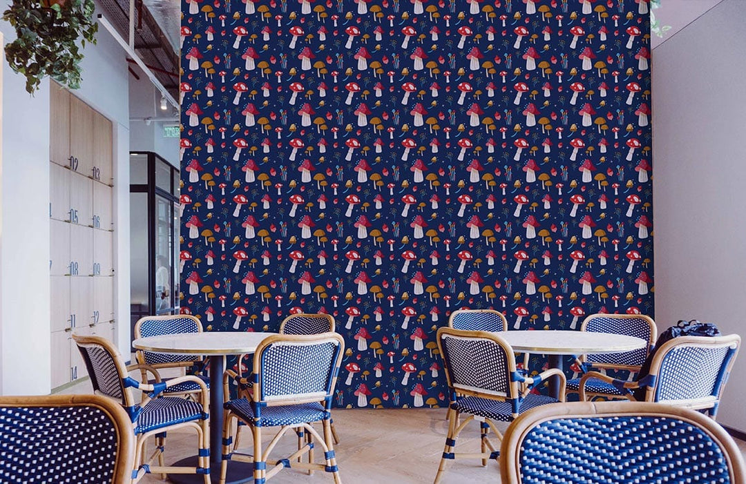 Whimsical Mushroom Wonderland Wallpaper in navy with multicolour design; dining chairs and tables visible.