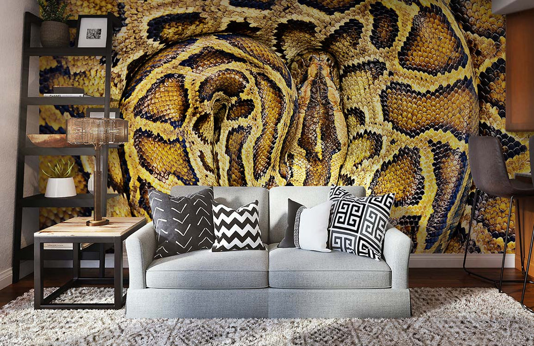 Exotic Golden Snake Pattern Wallpaper in modern living room with grey sofa, stylish shelving, and rug.