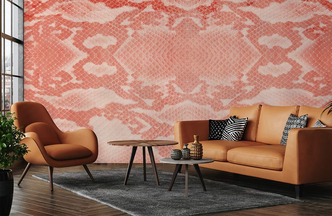 Coral and white snakeskin wallpaper with tan sofa, modern armchair, wooden flooring, stylish living room.