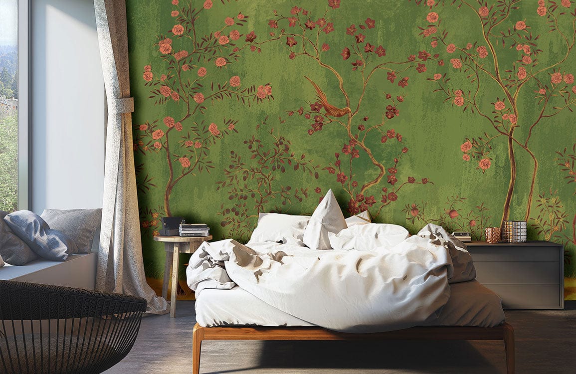 Elegant Green Chinoiserie Garden Wallpaper in bedroom with modern bed, grey sofa, and wooden flooring.