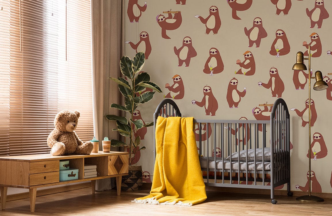 Playful Sloth Pattern Beige Wallpaper in nursery room with wooden floor, crib, and mustard blanket.
