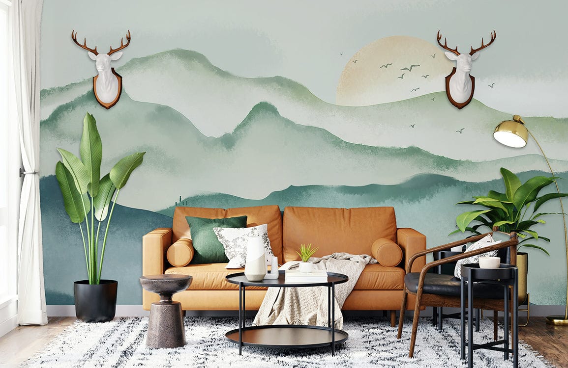 Misty Mountain Landscape Mural Wallpaper in green, featuring brown sofa, modern chairs, and textured rug.