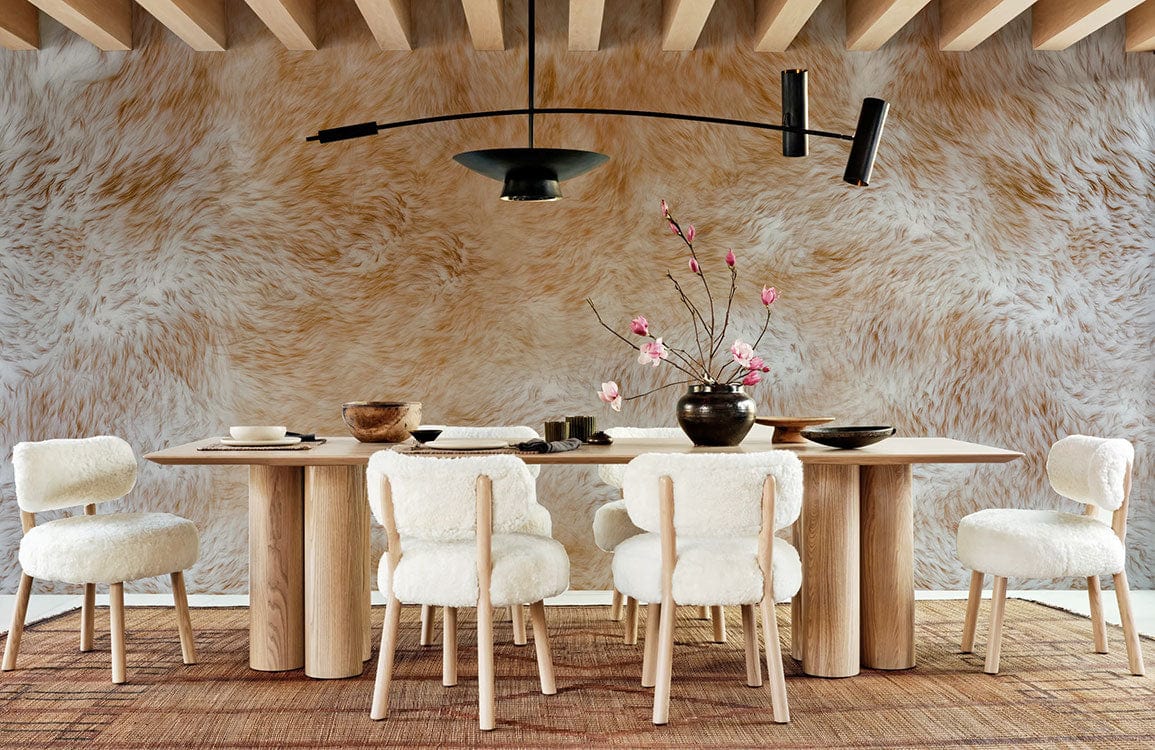 Luxurious faux fur wallpaper in warm tones, minimalist dining room with wooden table, white plush chairs.
