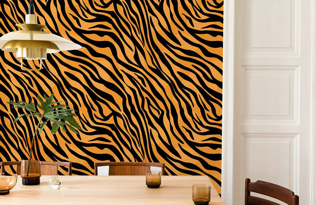 Safari tiger stripe wallpaper, orange and black. Wooden dining table, chairs, pendant lamp in dining room.