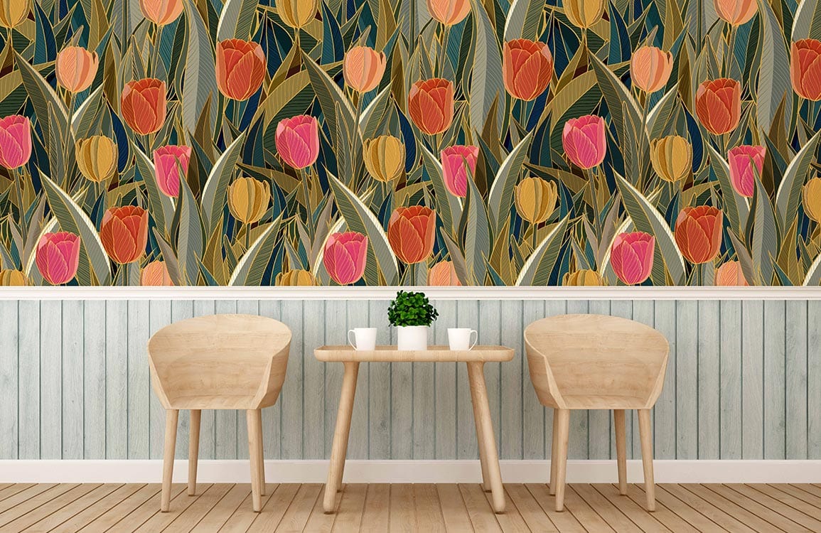 Two wooden chairs and table against vintage floral tulip wallpaper, rich earthy green and orange.