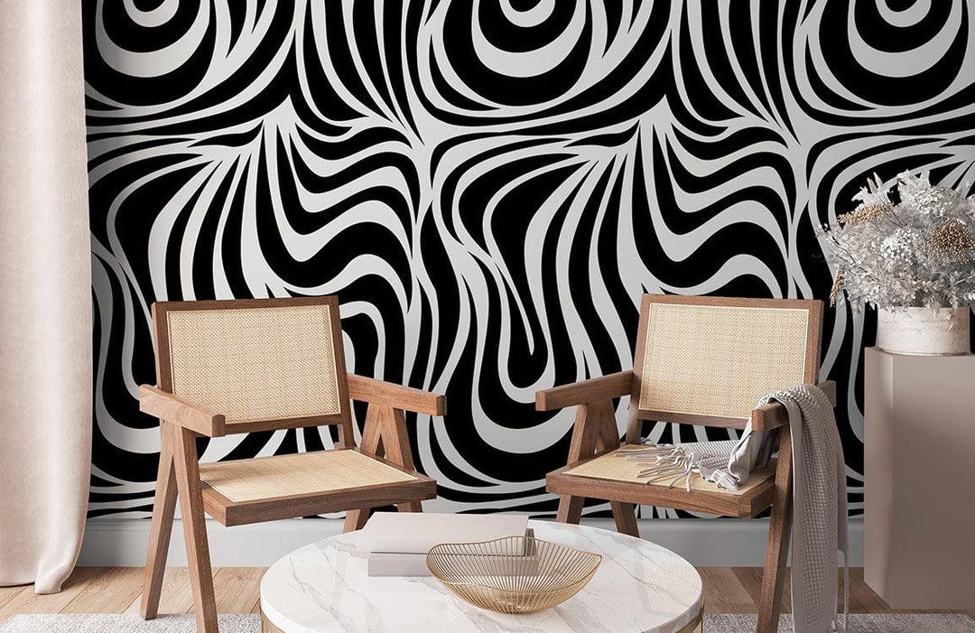 Monochrome abstract waves wallpaper with geometric pattern, wooden chairs, and marble coffee table in living room.
