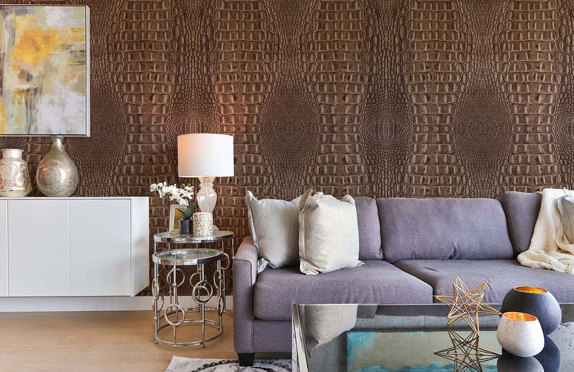 Elegant brown crocodile textured wallpaper, grey modern sofa, glass coffee table; chic living room design.