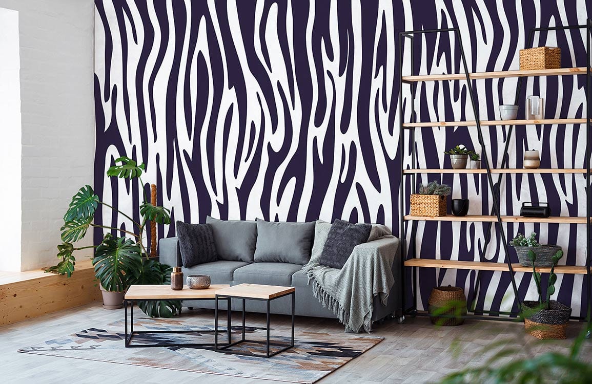 Monochrome zebra wallpaper, modern grey sofa, wooden flooring, industrial shelves in contemporary living room.