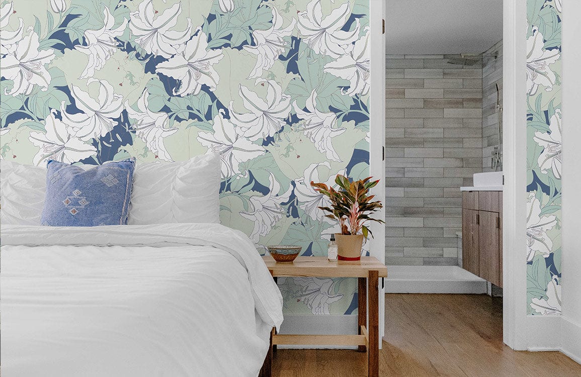 Elegant floral wallpaper in pastel greens, blues adorning bedroom; white bedding, light wood flooring, bathroom visible.