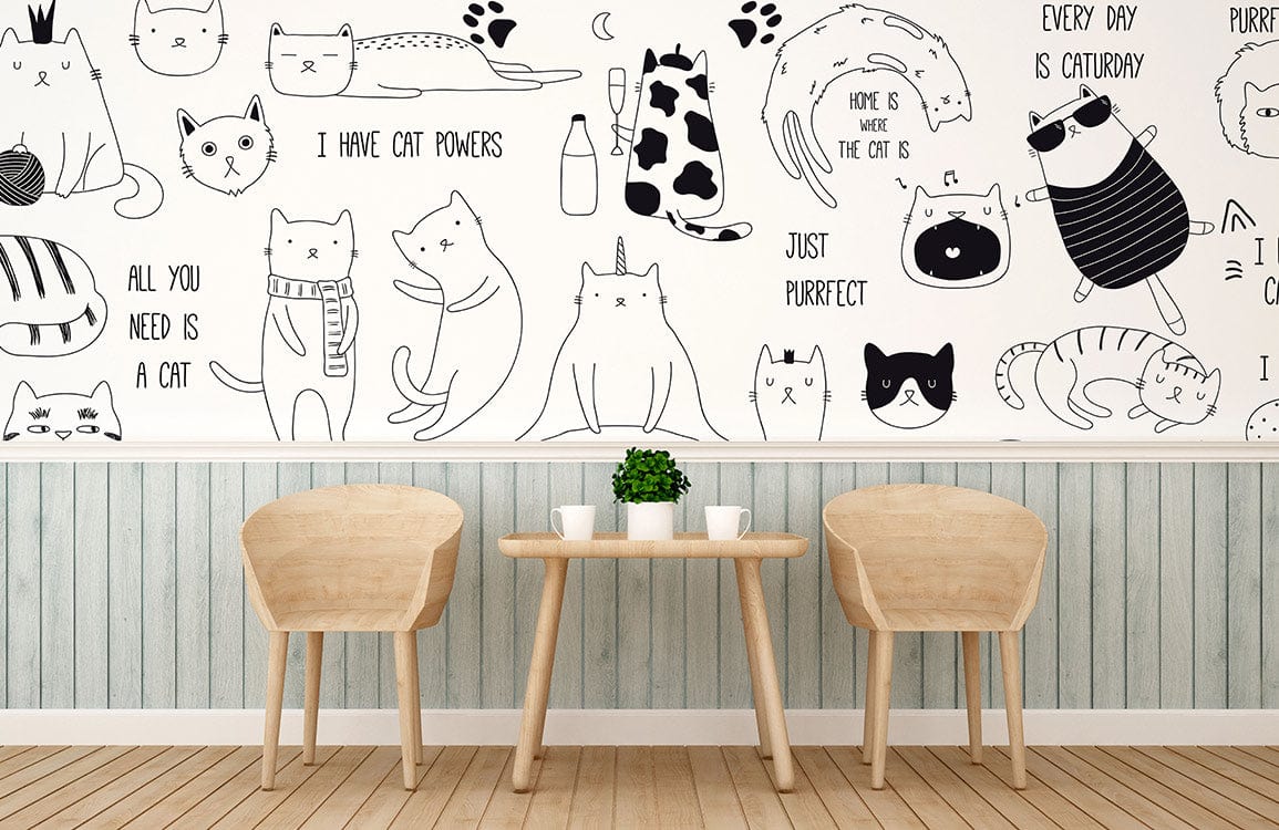 Playful cat mural wallpaper in bedroom with light wood chairs, table, and striped blue wall panelling.