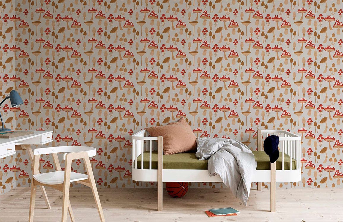 Whimsical Forest Mushrooms Wallpaper in warm earthy hues decorates the children's room with minimalist furniture.