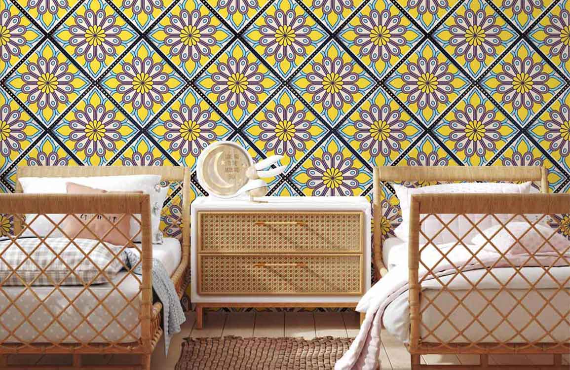Dual rattan beds, Mediterranean floral pattern wallpaper, colourful tiles, wooden flooring, woven rug in bedroom.