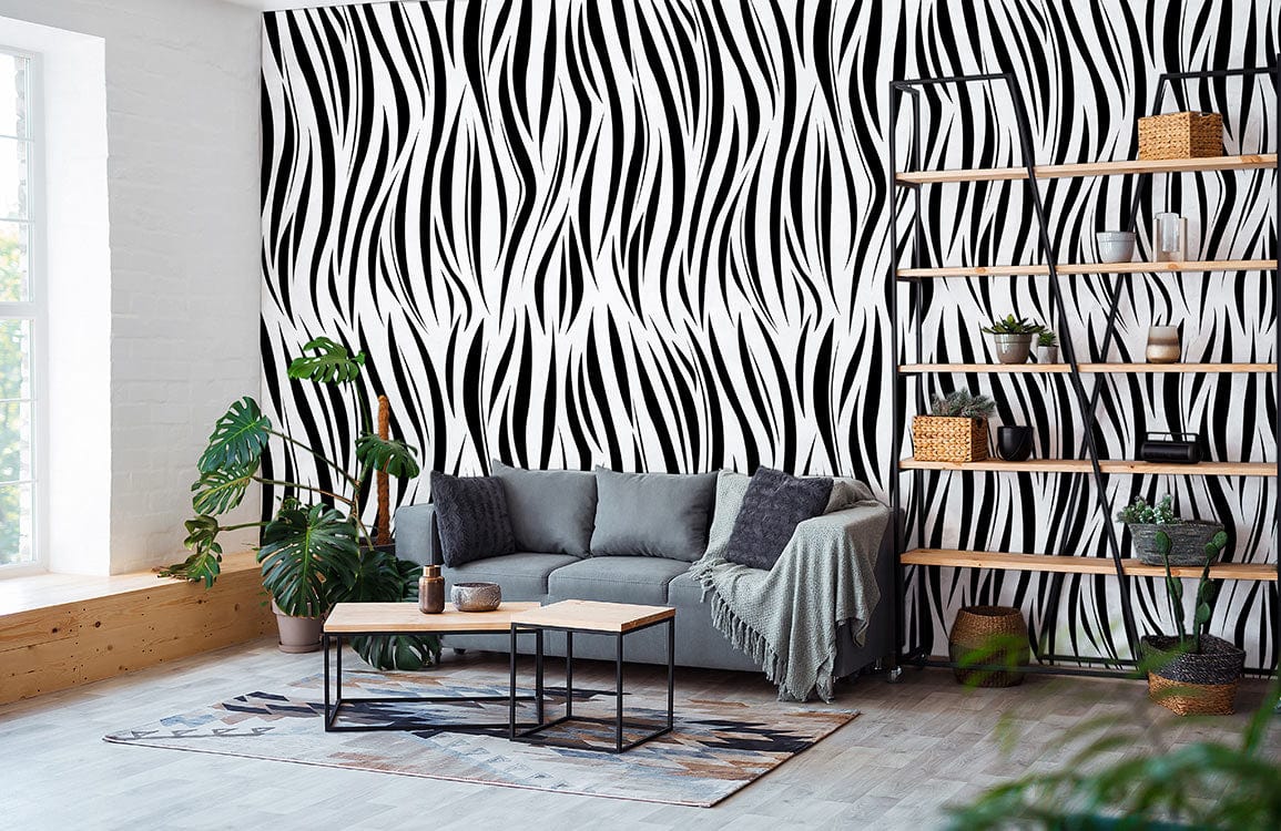 Monochrome abstract wave wallpaper, grey sofa, wooden floor, stylish living room with modern black-and-white design.